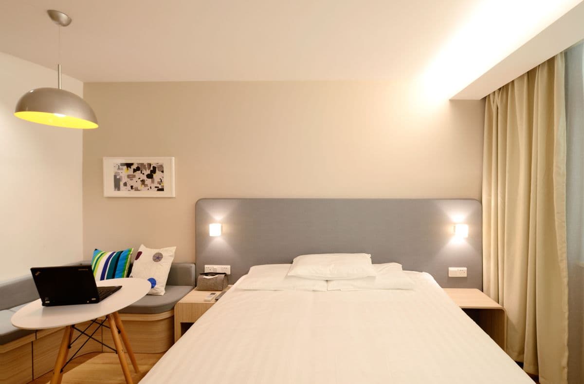 Standard hotel room with soft lighting